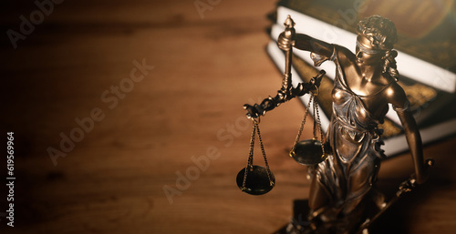 Justice and legal book on wooden table