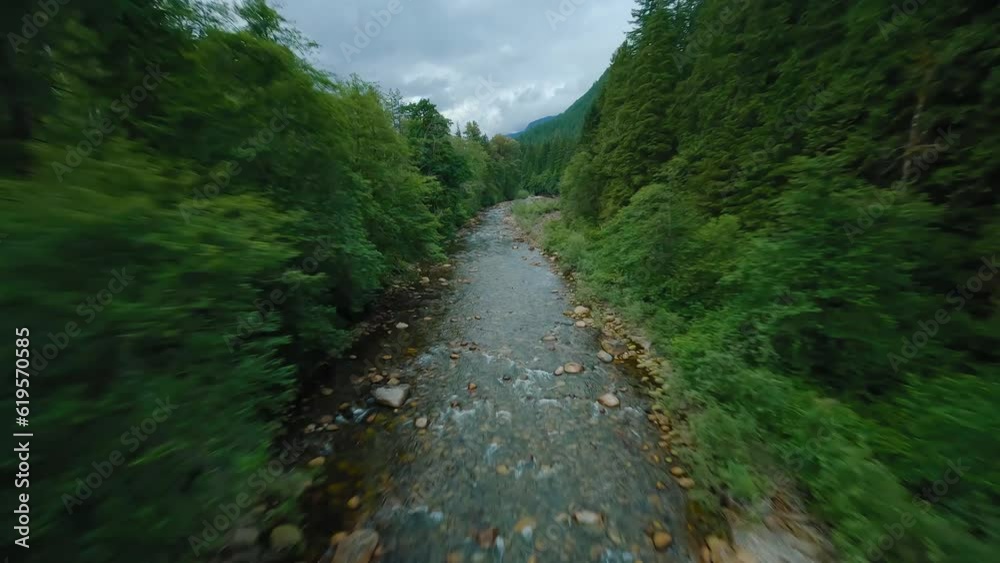 Flight over a mountain river. Shot on FPV drone. British Columbia, Canada. Flight over a mountain river. Shot on FPV drone. British Columbia, Canada.