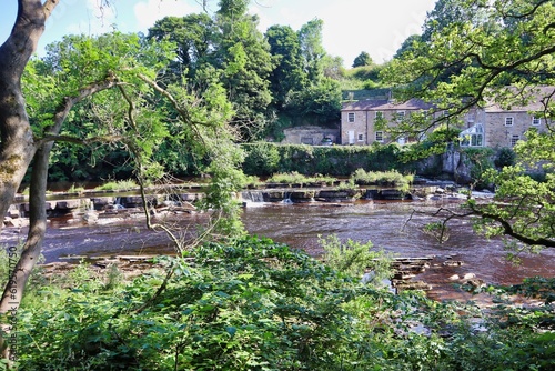 Pretty icturesque country house cottage near water stream waterfall 