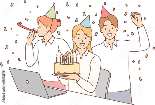 Birthday party with office colleagues and friends from work giving cake and using confetti