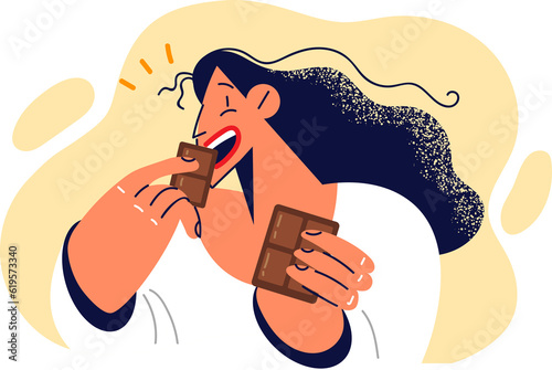 Woman eats dark chocolate enjoying sweet milk dessert that causes surge energy and positive emotions