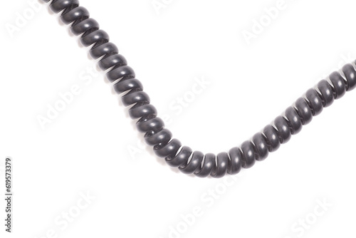 Black spiral telephone cord isolated on white background
