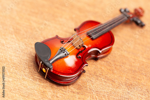 Classic violin on a wooden background