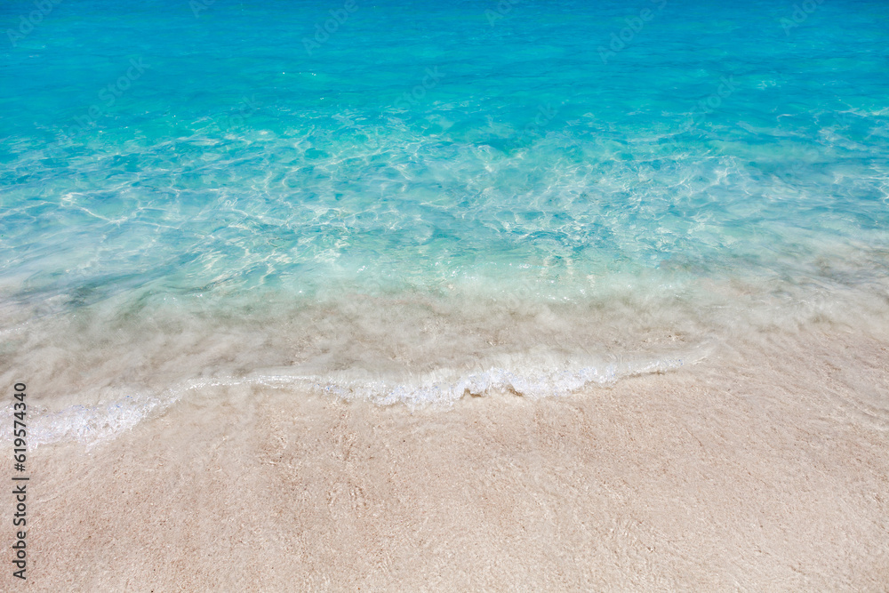 Sea surf with turquoise water close-up on sandy tropical beach Sea surf with turquoise water close-up on sandy tropical beach