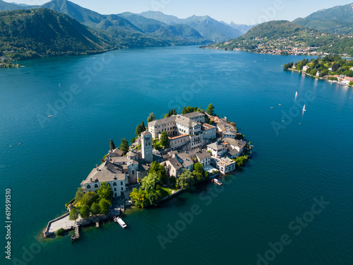 San Giulio island on Lake Orta (Piedmont, Italy) at evening. Aerial view. Italian landscape.