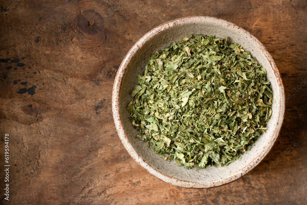 Dried Parsley Flakes in a Bowl Dried Parsley Flakes in a Bowl