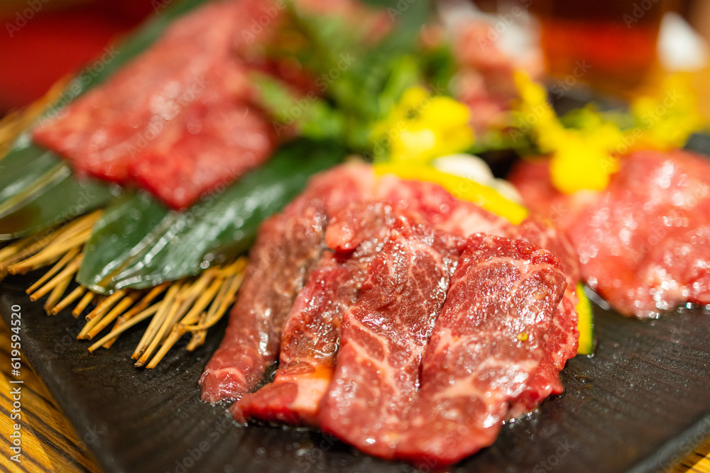 Slice of raw beef meat in korean BBQ restaurant Slice of raw beef meat in korean BBQ restaurant