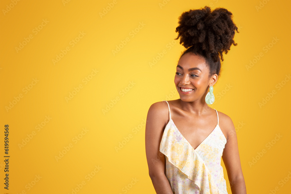 Happy pretty young african american woman in dress looking at empty space Happy pretty young african american woman in dress looking at empty space