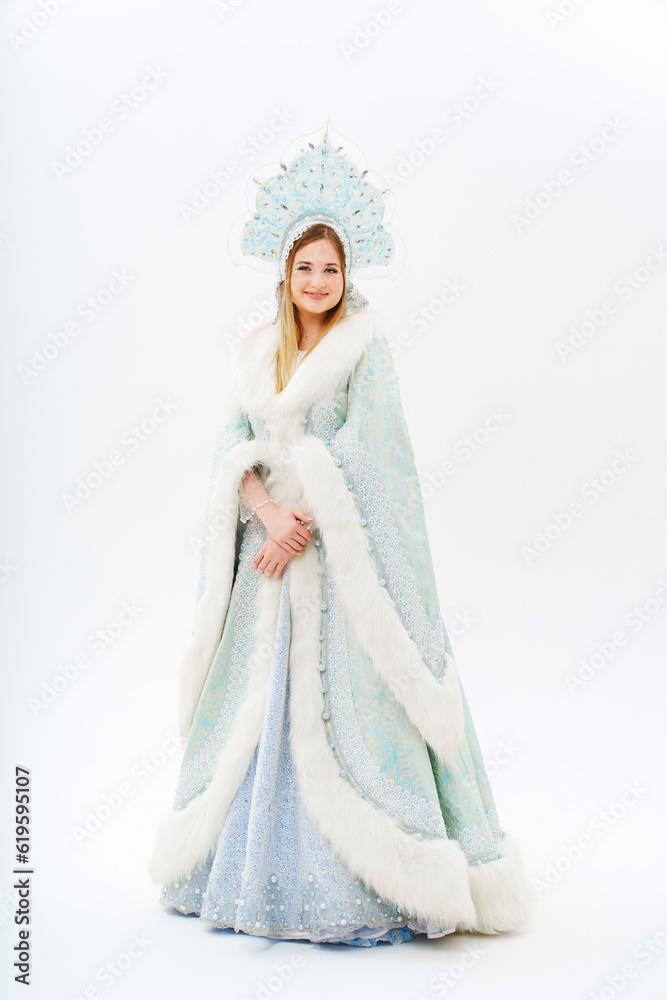 Snow Maiden in a traditional costume with a kokoshnik on a white background. Snow Maiden in a traditional costume with a kokoshnik on a white background.