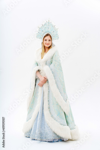 Snow Maiden in a traditional costume with a kokoshnik on a white background. 