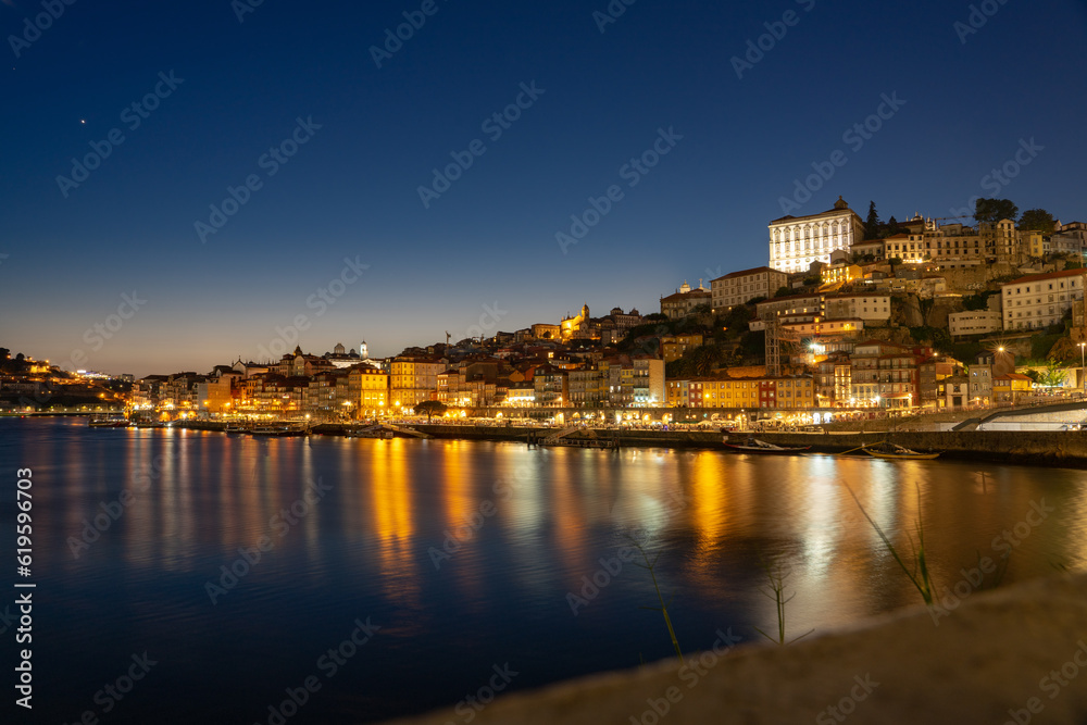 skyline in the evening freom dom luiz brige in Porto on the riverside of Duero river cityscape at night