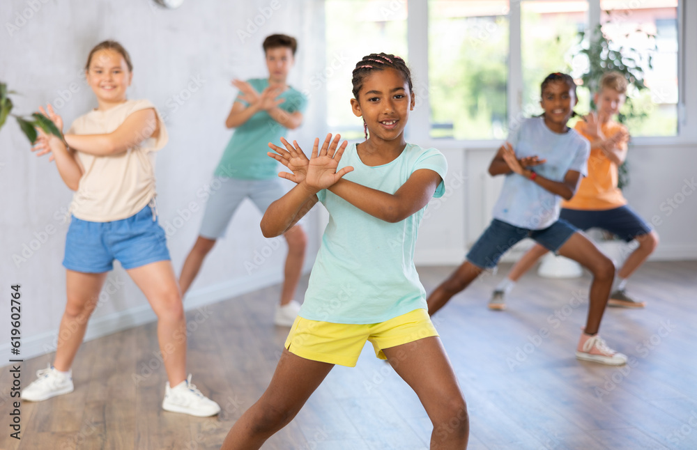 Dance studio smiling girls and boys in dance lesson. High quality photo