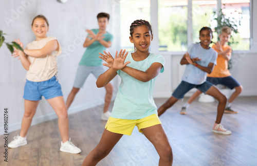 Dance studio smiling girls and boys in dance lesson. High quality photo