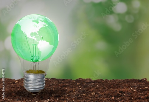 Light Bulb and nature Green Background,