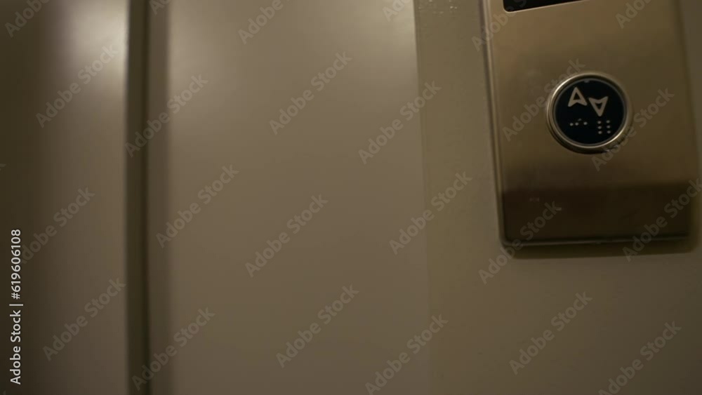 An Caucasian woman with a bottle of sparkling wine enters the elevator after a party. A drunk cheerful girl in a dress returns home after a party in a club. High quality 4k footage An Caucasian woman with a bottle of sparkling wine enters the elevator after a party. A drunk cheerful girl in a dress returns home after a party in a club. High quality 4k footage