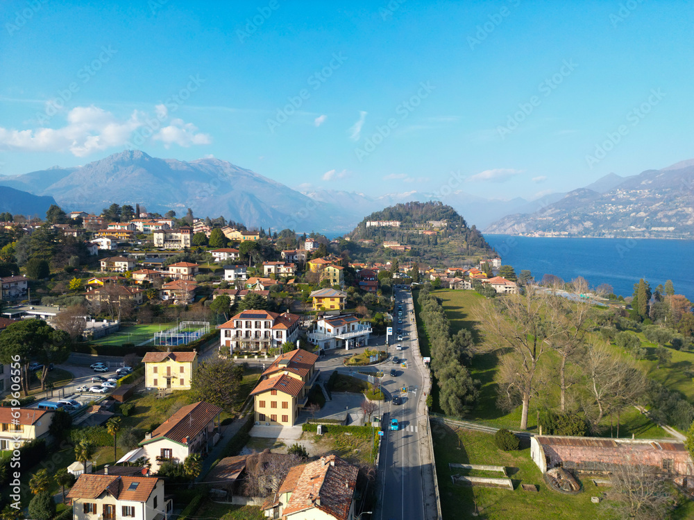 Aerial view of Bellagio in lake Como, a picturesque and traditional village in Lombardy, Italy. High top view to water landscape with green hills, mountains in summer. Drone lake Como.