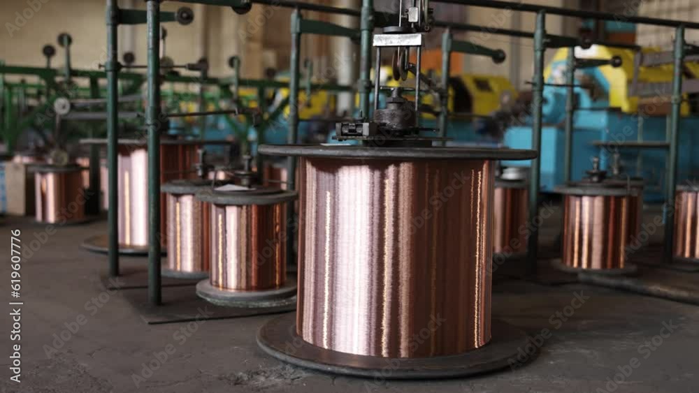 Coil storage, Wire specifications, Copper fabrication. Plant for copper wire production is home to several large copper coil spools. Coil storage, Wire specifications, Copper fabrication. Plant for copper wire production is home to several large copper coil spools.