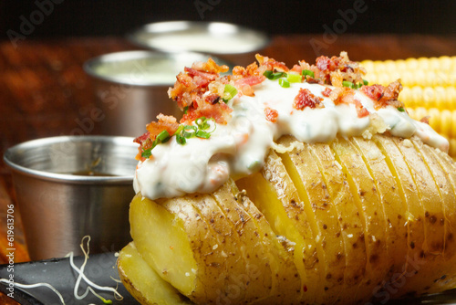 Baked potato with cream cheese, bacon and chive topping