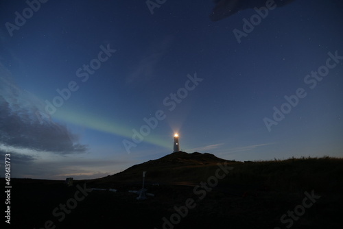 Aurora with light house