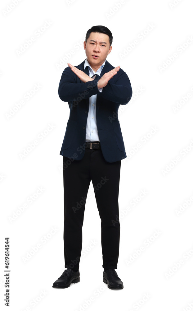 Angry businessman in suit posing on white background Angry businessman in suit posing on white background