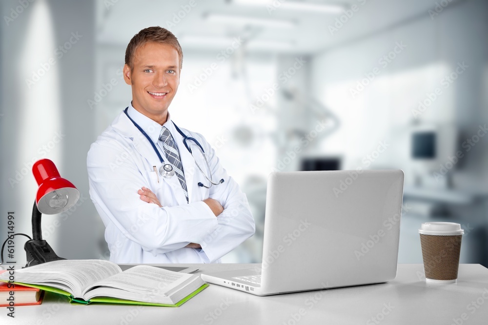 Doctor, healthcare worker at hospital working with laptop Doctor, healthcare worker at hospital working with laptop