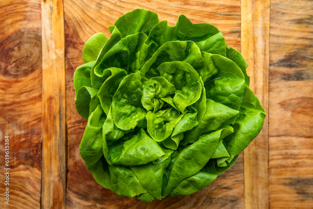 Overhead view of fresh lettuce on wooden surface Overhead view of fresh lettuce on wooden surface