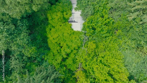 Drone view of an abandoned and abandoned building in the forest. Drone flight over a destroyed building in the forest.