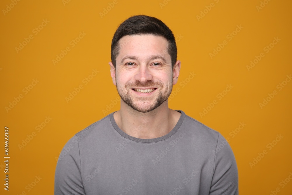 Portrait of handsome man on orange background Portrait of handsome man on orange background