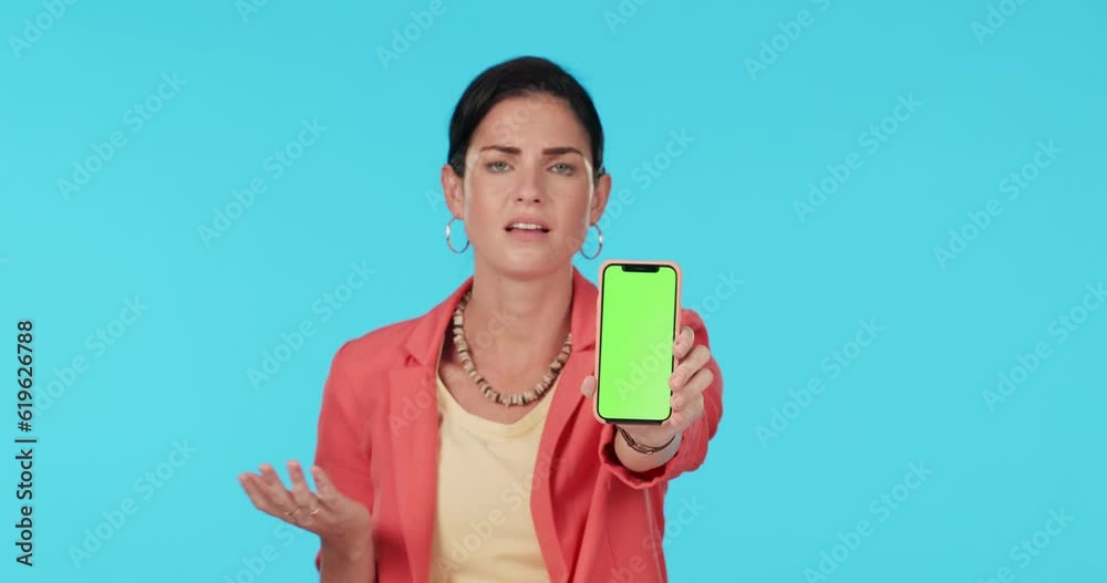 Phone, green screen and a woman asking on blue background in studio scratching head in frustration. Portrait, doubt or chromakey on a mobile screen and a young confused female person with a question Phone, green screen and a woman asking on blue background in studio scratching head in frustration. Portrait, doubt or chromakey on a mobile screen and a young confused female person with a question