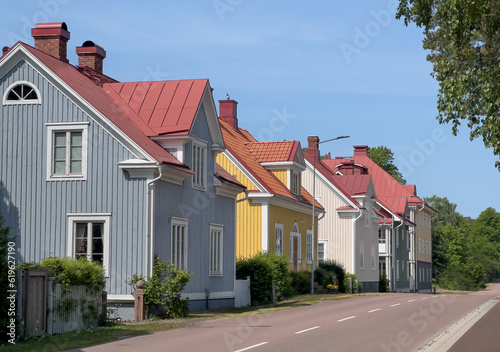 Fototapeta Naklejka Na Ścianę i Meble -  A row of quaint colorful houses on a quiet street in Mariehamn, Åland Islands, Finland.