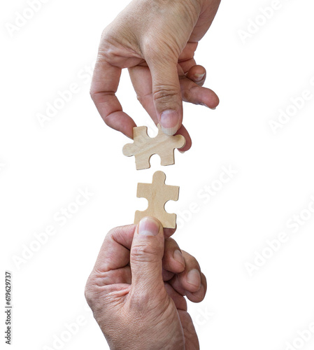 Two hands trying to connect puzzle pieces, isolated on transparent background.