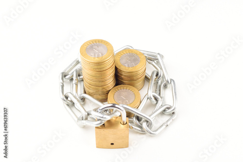 Indian money locked with chain and padlock isolated on white background, money safety concept