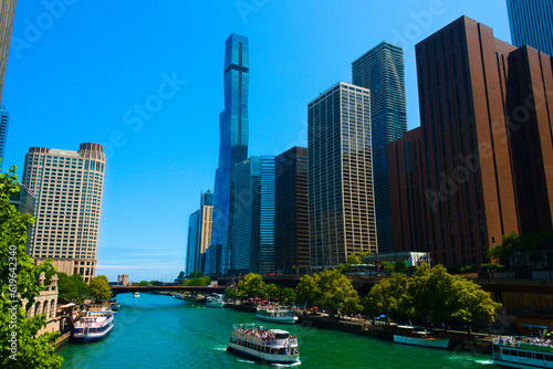 Striking view of Chicago city skyscrapers towering over and urban river