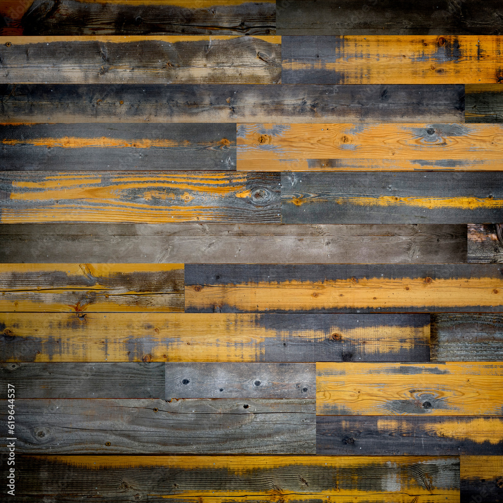 Dark stained reclaimed wood surface with aged boards lined up. Wooden