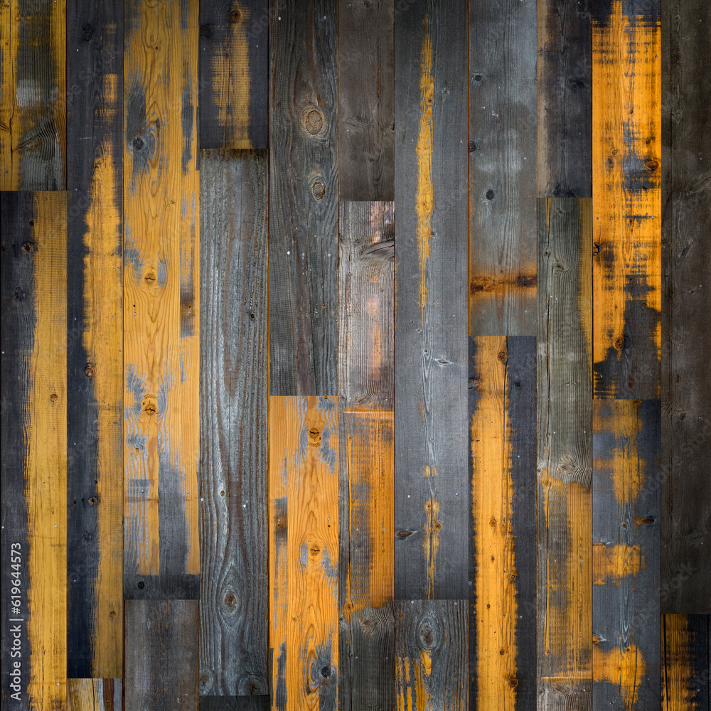Dark stained reclaimed wood surface with aged boards lined up. Wooden