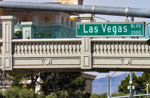 Las Vegas Boulevard street sign. Pedestrian walking bridge is visible in the background. 