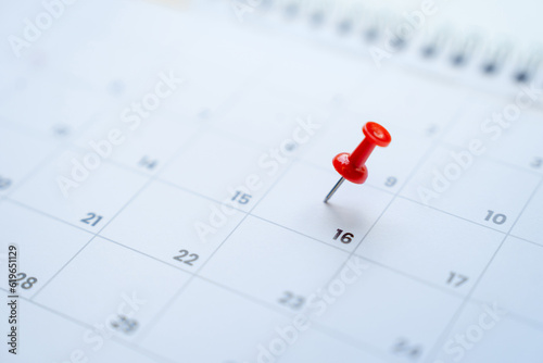 Red pin on the 16th day on the calendar, appointments and meeting reminders.