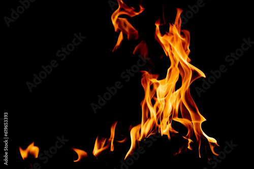 Fire flame texture. Burning material backdrop. Burn effect pattern. Blaze and torch wallpaper. Heat and haze backdrop. © Ionatan