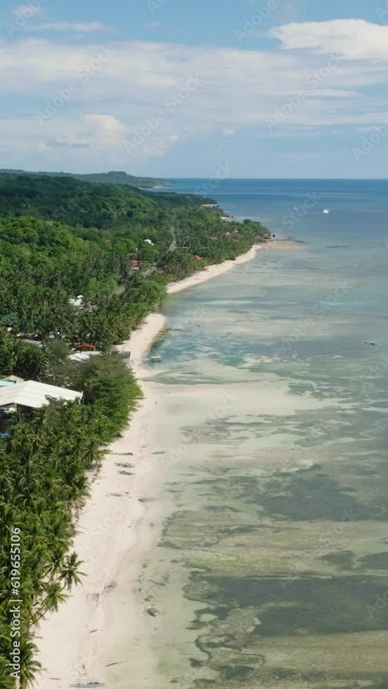 Flying from above in this beautiful tropical island with palm trees at coast. Siquijor, Philippines. Flying from above in this beautiful tropical island with palm trees at coast. Siquijor, Philippines.