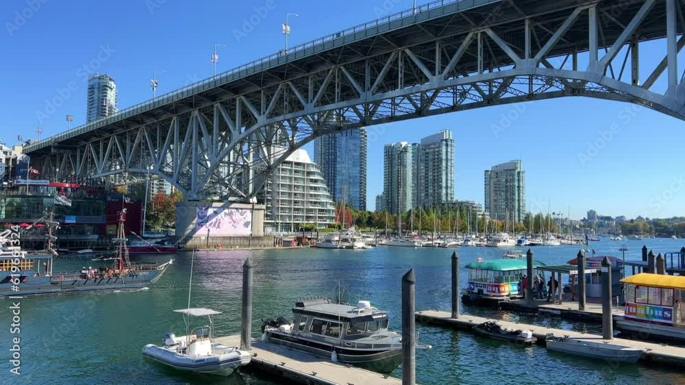 Granville Island peninsula and shopping district in Fairview district of Vancouver BC across False Creek from downtown Vancouver under southern end of the Granville Street Bridge Canada Granville Island peninsula and shopping district in Fairview district of Vancouver BC across False Creek from downtown Vancouver under southern end of the Granville Street Bridge Canada