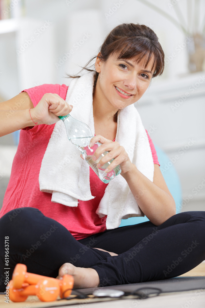beautiful woman doing exercise with dumbbells