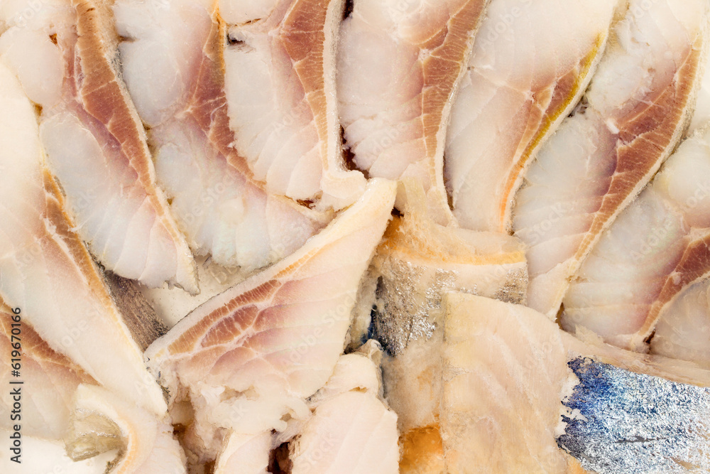 Pieces of fish fillet. Canned fish. Herring fillet close-up. Pieces of fish fillet. Canned fish. Herring fillet close-up.