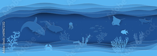 Paper cut  concept of world oceans day with underwater sea cave and fishes.Paper cut style vector illustration.