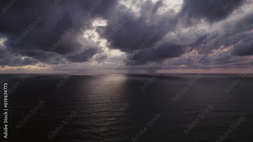 Storm clouds and rain over sea, Dark storm clouds passing video,High quality footage clouds over sea and waves background Storm clouds and rain over sea, Dark storm clouds passing video,High quality footage clouds over sea and waves background