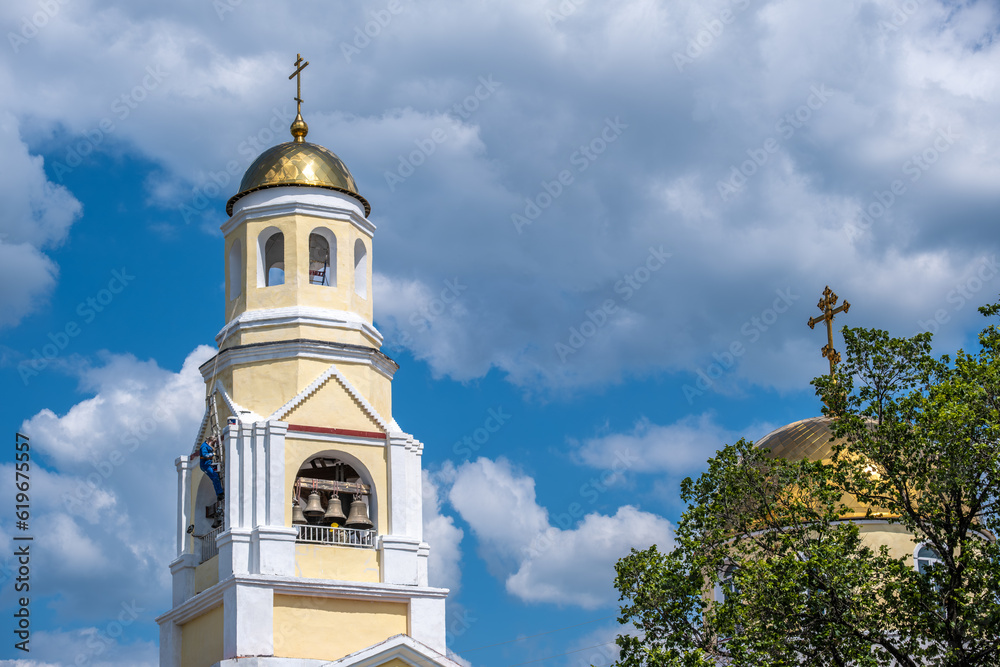 The old church against the sky on a sunny summer day.