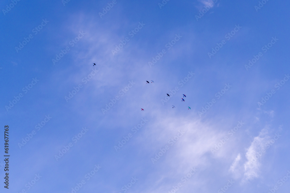Colorful kites flying in the sky. a group of kites flying against blue sky