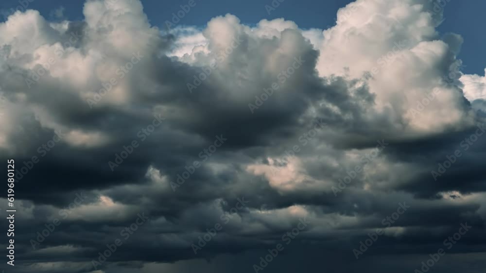 Rain clouds at sunset. Thunder clouds move quickly Rain clouds at sunset. Thunder clouds move quickly