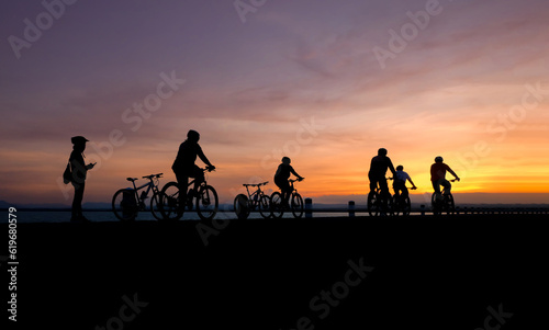 Silhouette of cyclist biking at the sunset