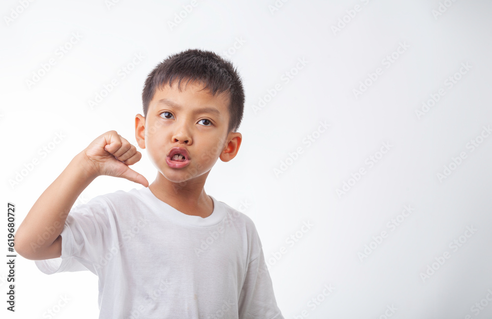 Asian boy showing anger dissatisfied demeanor Asian boy showing anger dissatisfied demeanor