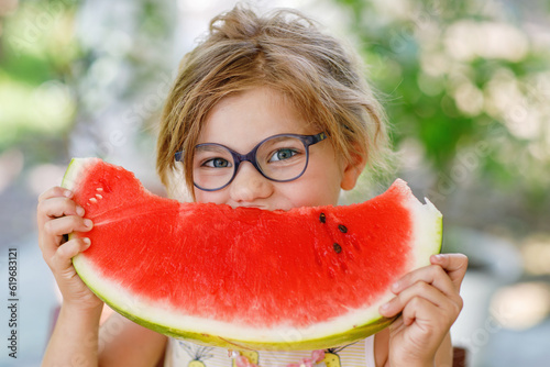 Little Girl, Preschooler, Delights in a Juicy Watermelon on a Sunny Summer Day. Child sharing a Healthy Snack with Her Family, She Embraces the Joy of Summertime Bliss